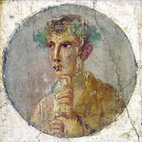 Young man wearing holding a rotulus document